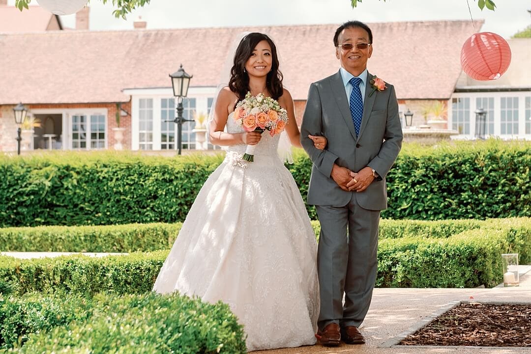 bride and bride's father arriving at froyle park wedding