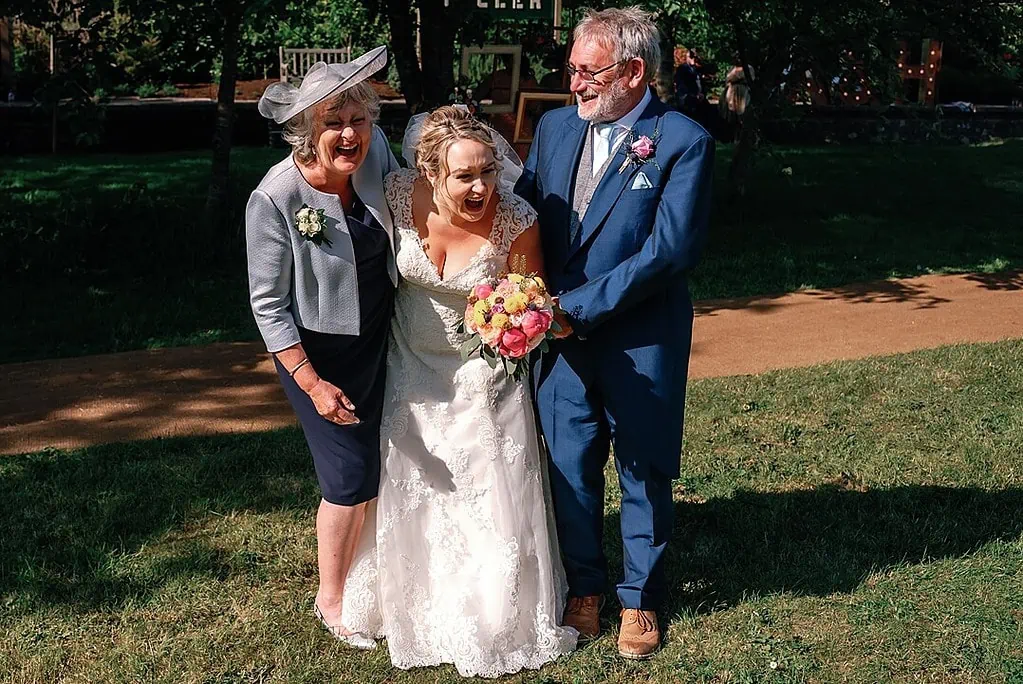Group photograph of the bride and her parents