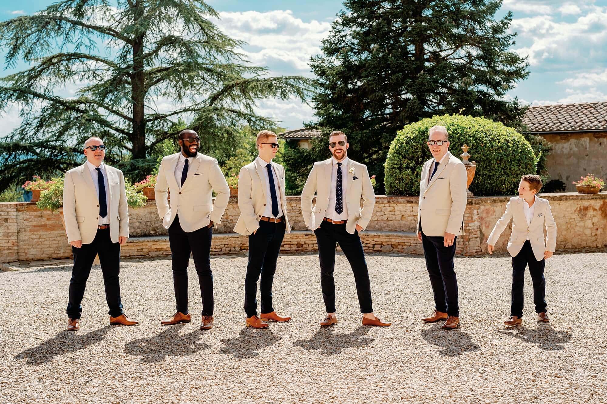 The groom and groomsmen posing at the villa in Siena