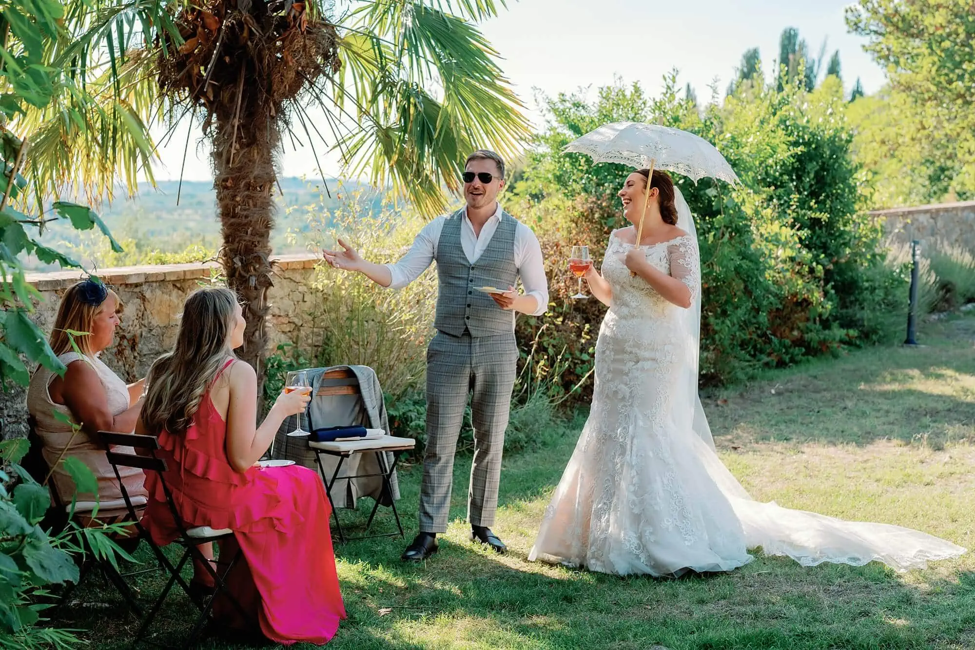 bride and guests laughing at the reception at villa catignano