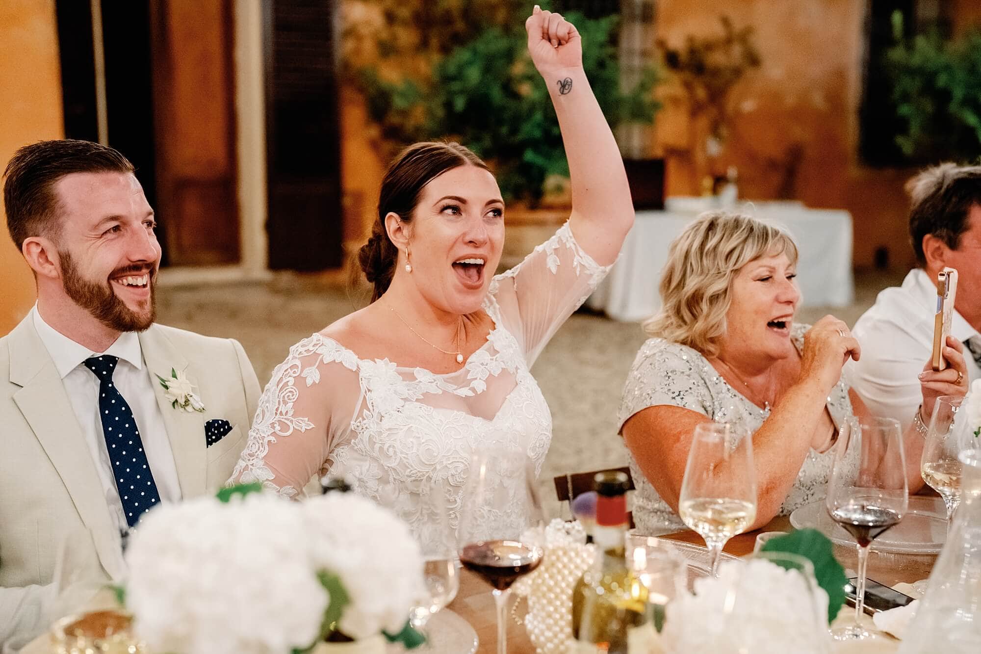 Bride happy during the speeches at villa catignano wedding photography