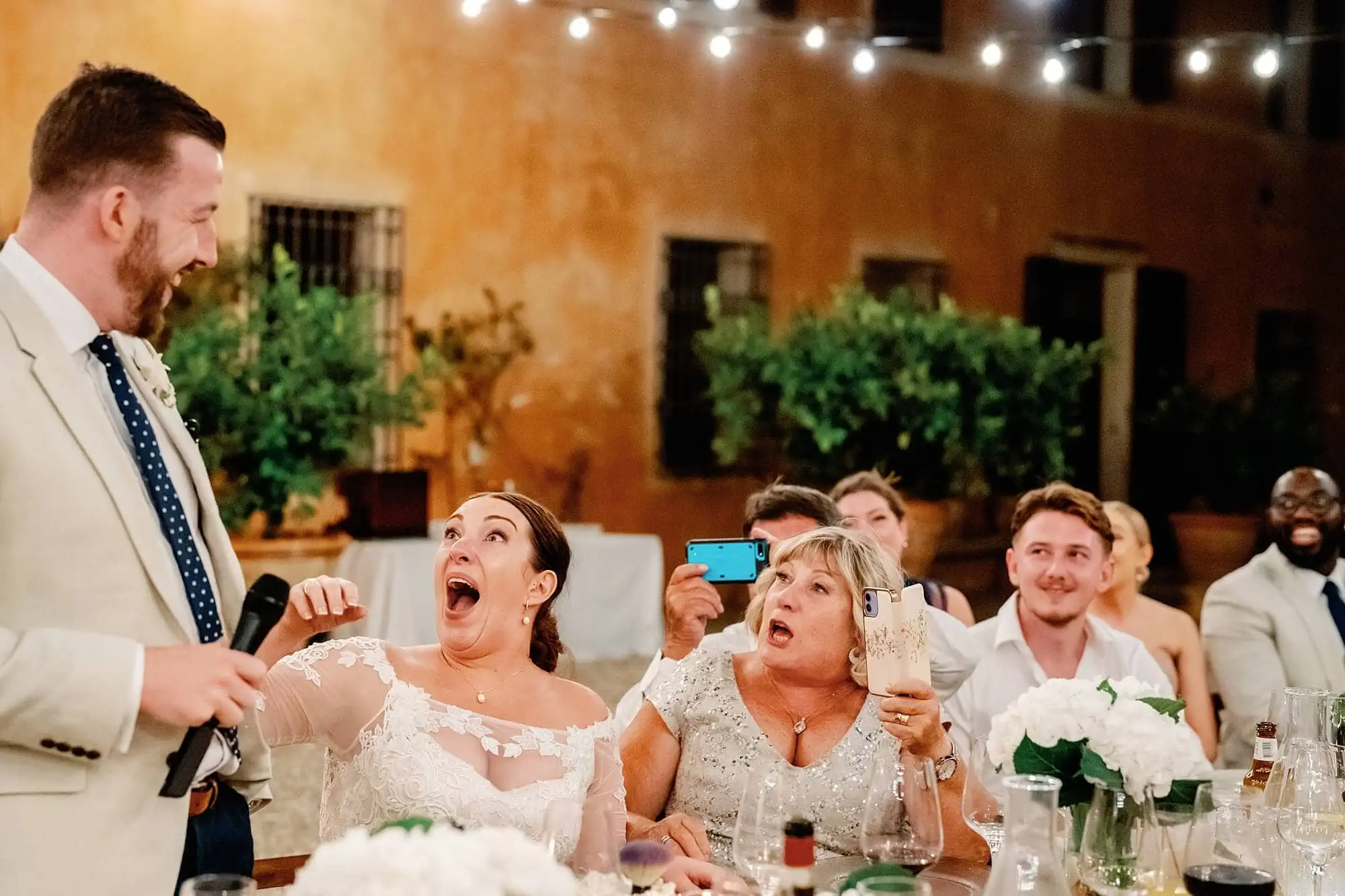 Surprised reaction of the bride and mum during the speeches in Italy