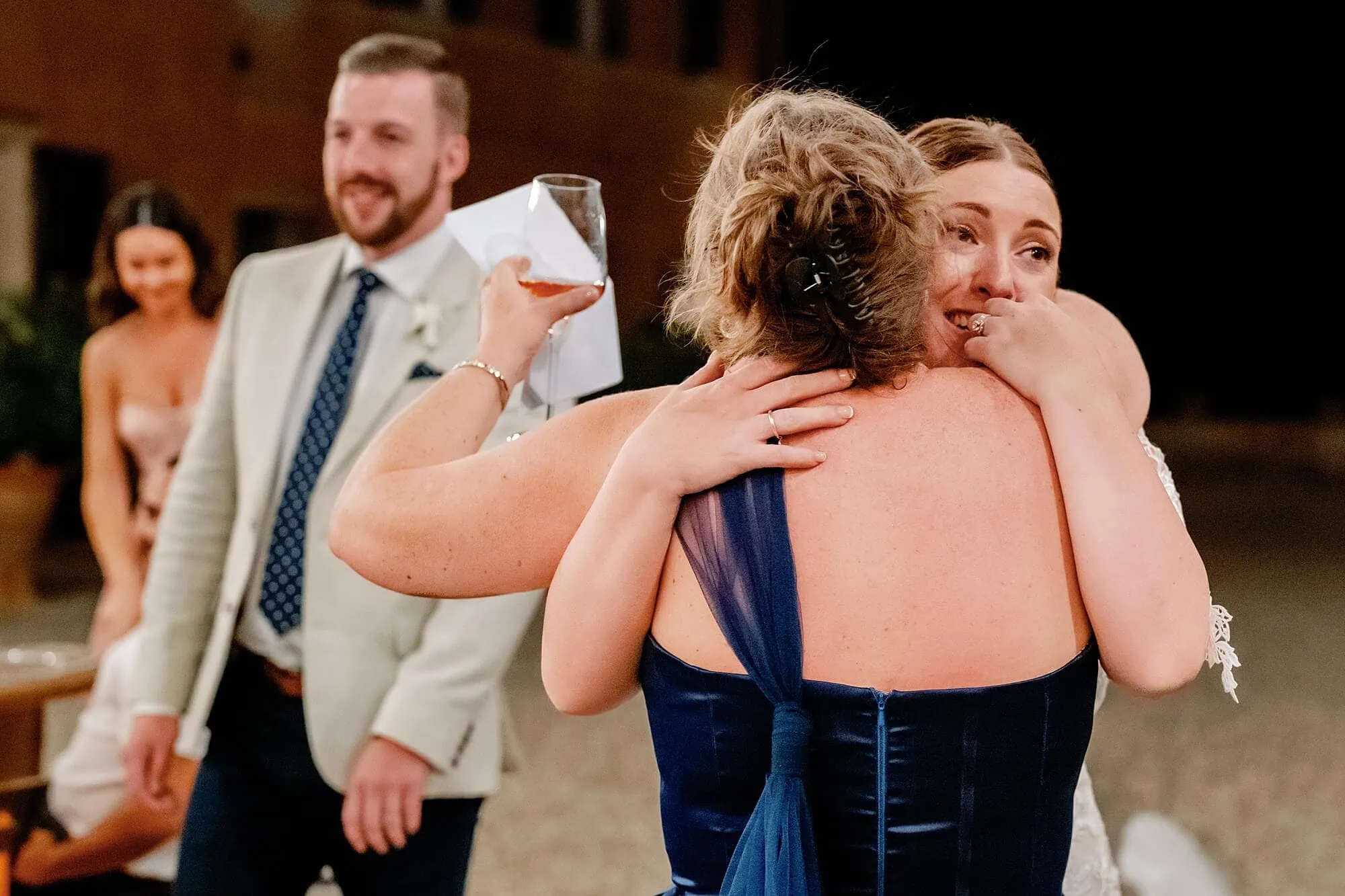 bride hugging a bridesmaid at the end of the speech in Tuscany