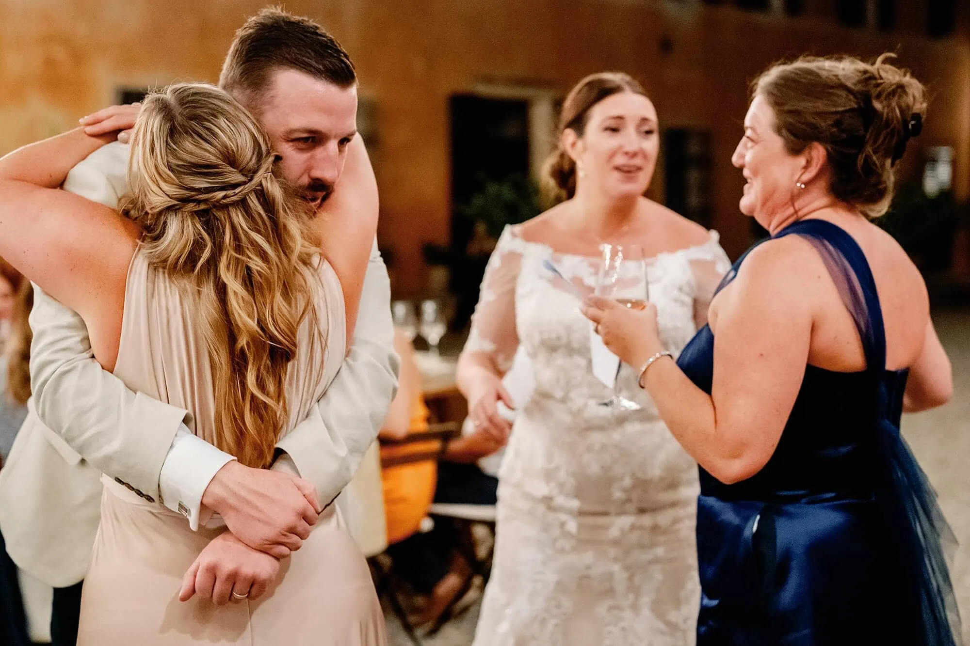 groom hugging bridesmaid after speech at villa catignano