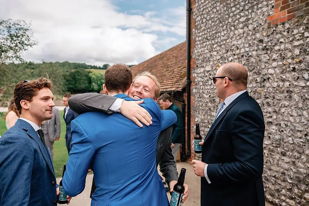 hugging the groom at Farbridge