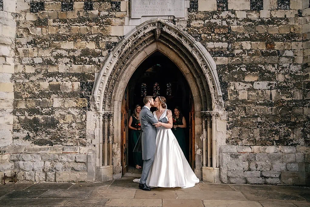 kissing outside the church at Waltham Abbey
