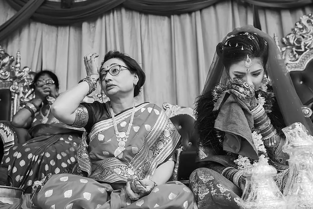 emotional bride, and two aunts during the mukh herne