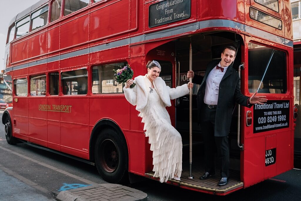 bride and groom on an old red London Routemaster