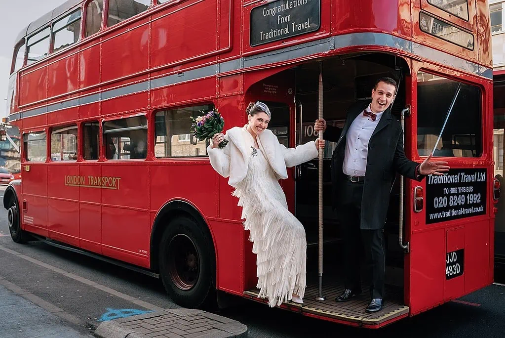 bride and groom on an old red London Routemaster