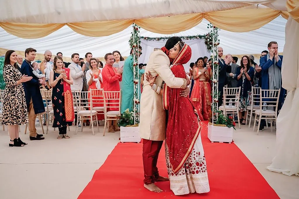 hugs at the end of the indian wedding