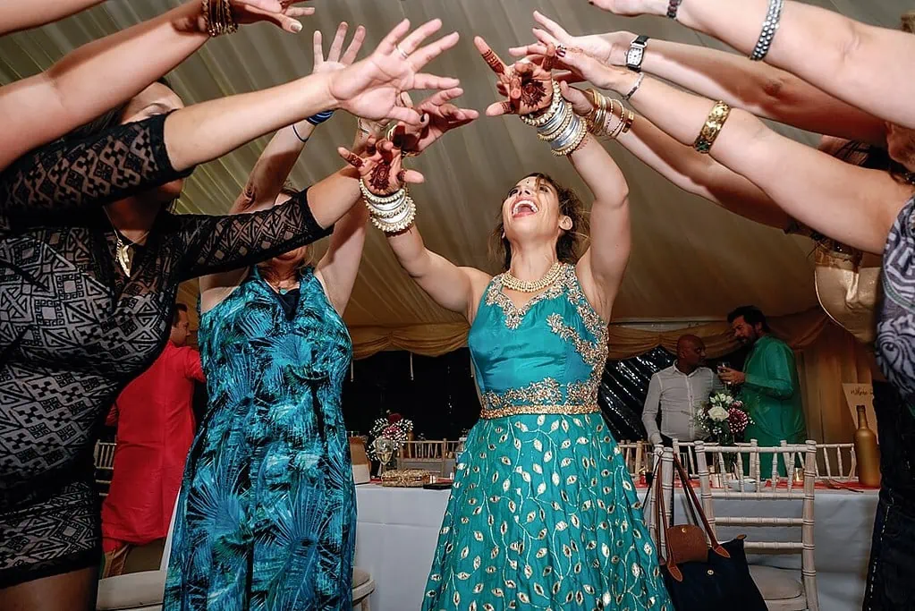 bride dancing at indian wedding