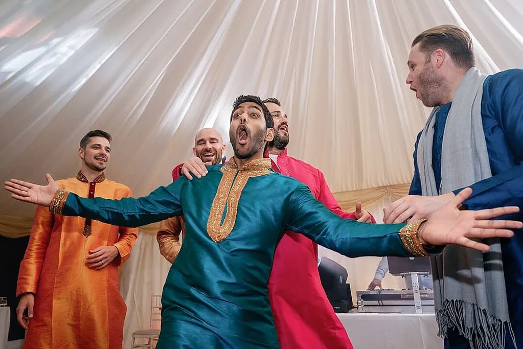 groom dancing at indian wedding