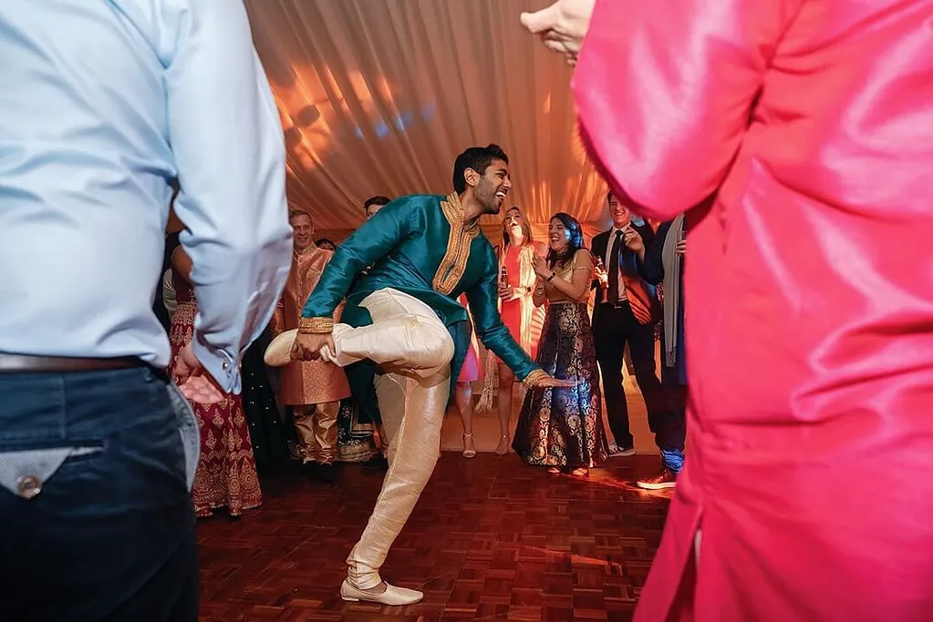 groom dancing at the indian wedding