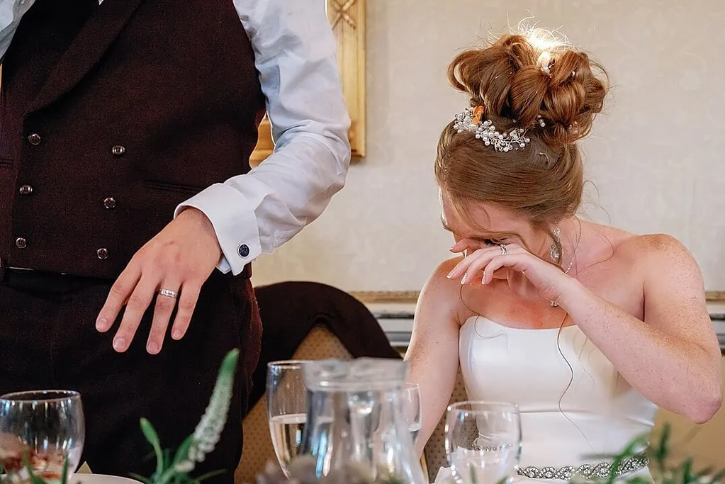 crying bride during the groom's speech