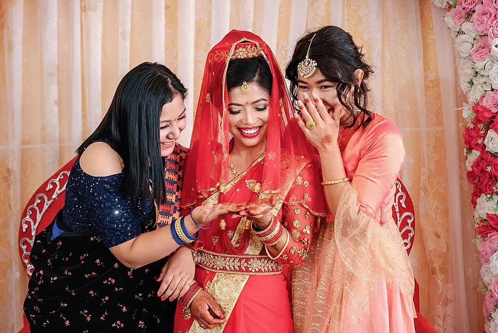bride palm reading with bridesmaid in pokhara