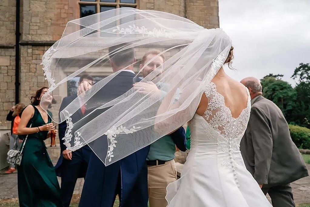 bride's veil caught in the wind