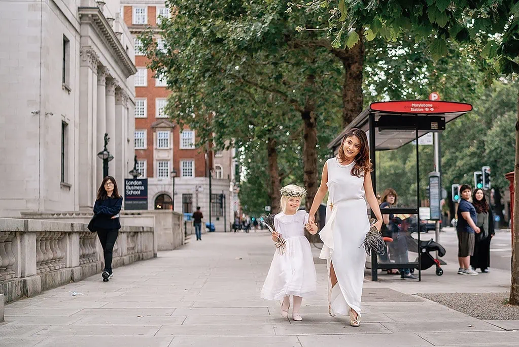 bride and flower girl arriving at The Old Marylebone Town Hall