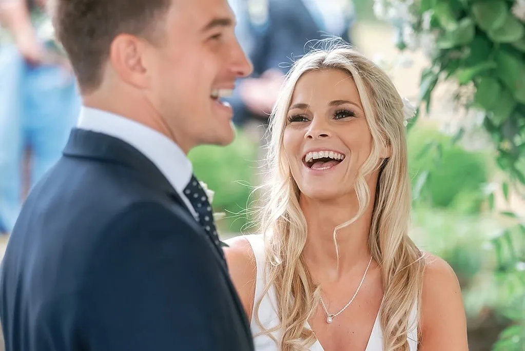 laughing bride and groom during the wedding ceremony