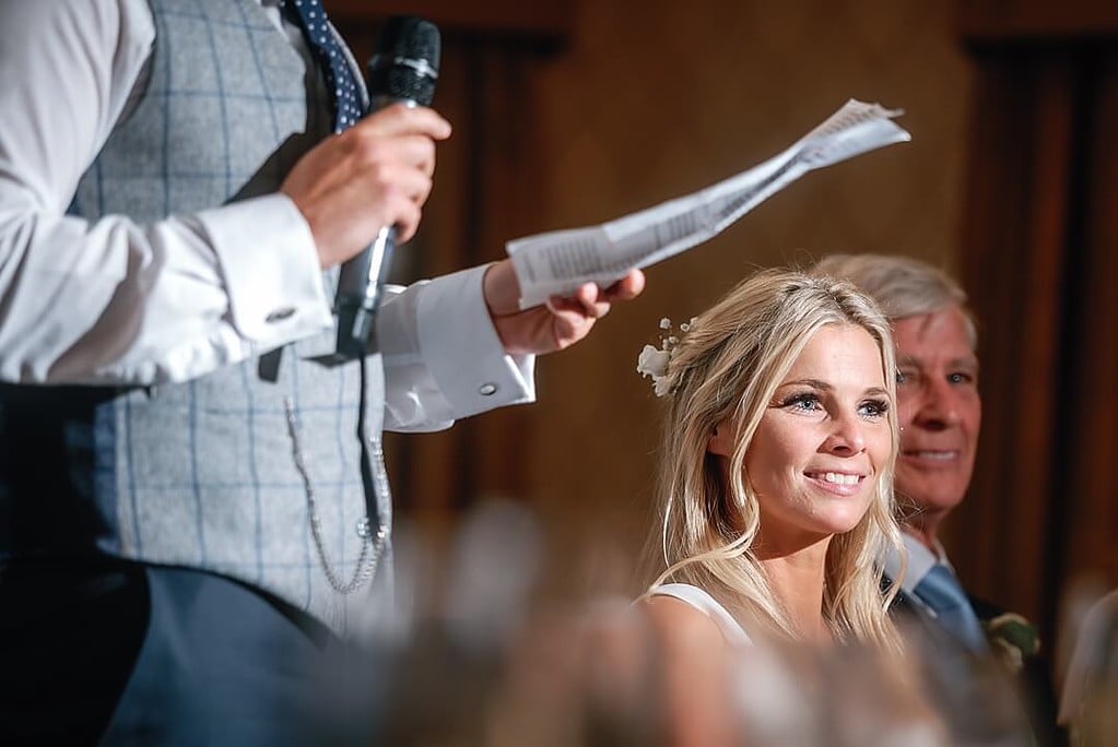 bride listening to her husband's speech at Pennyhill Park