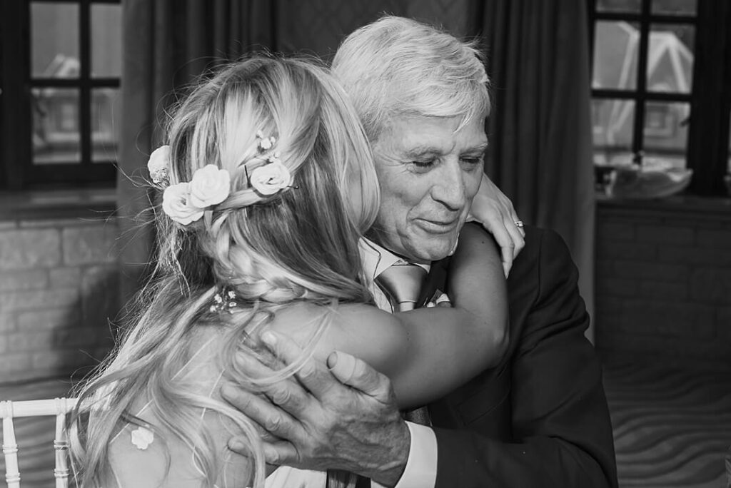 bride hugging her dad after the speeches