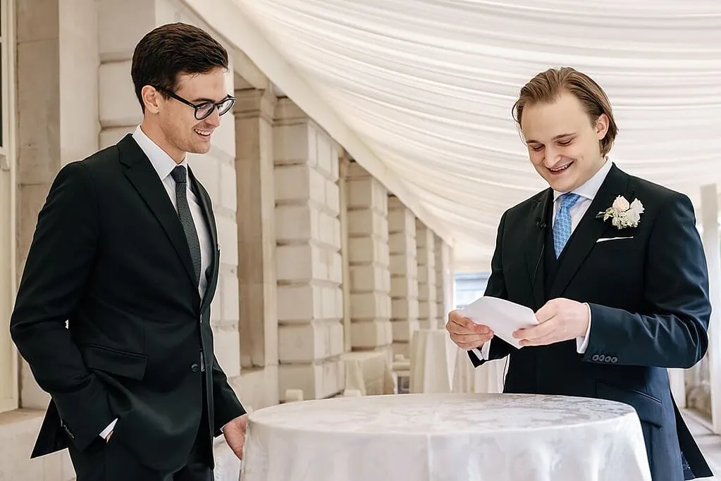 groom reading a letter from the bride