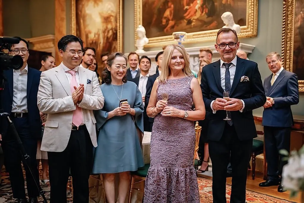 parents watching the cake cut at Spencer House