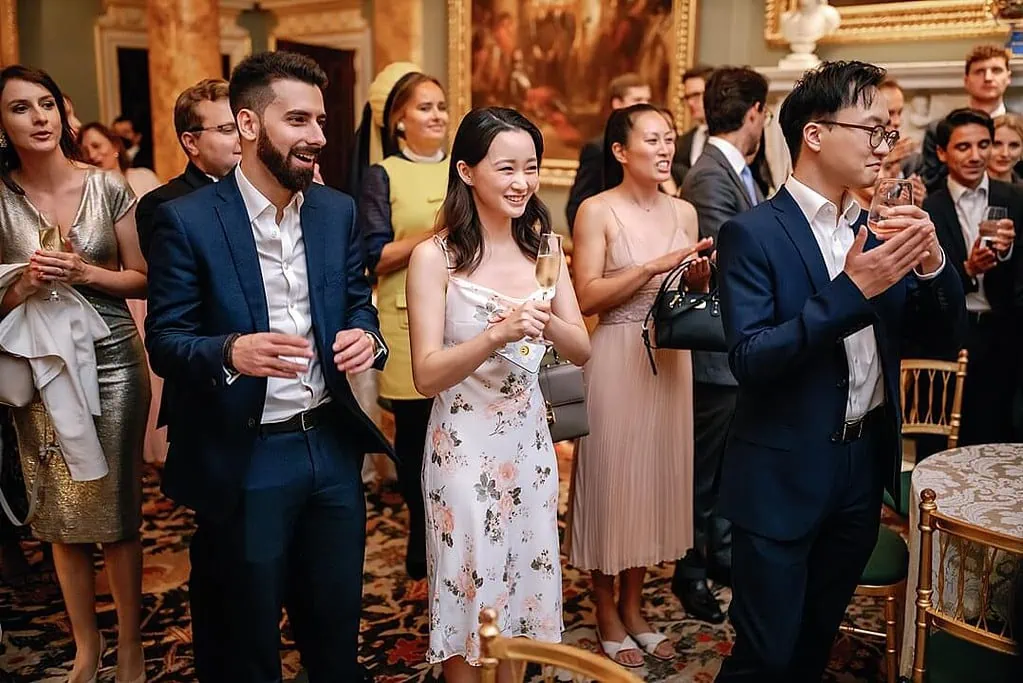guests reaction during the cake cut spencer house wedding photograper