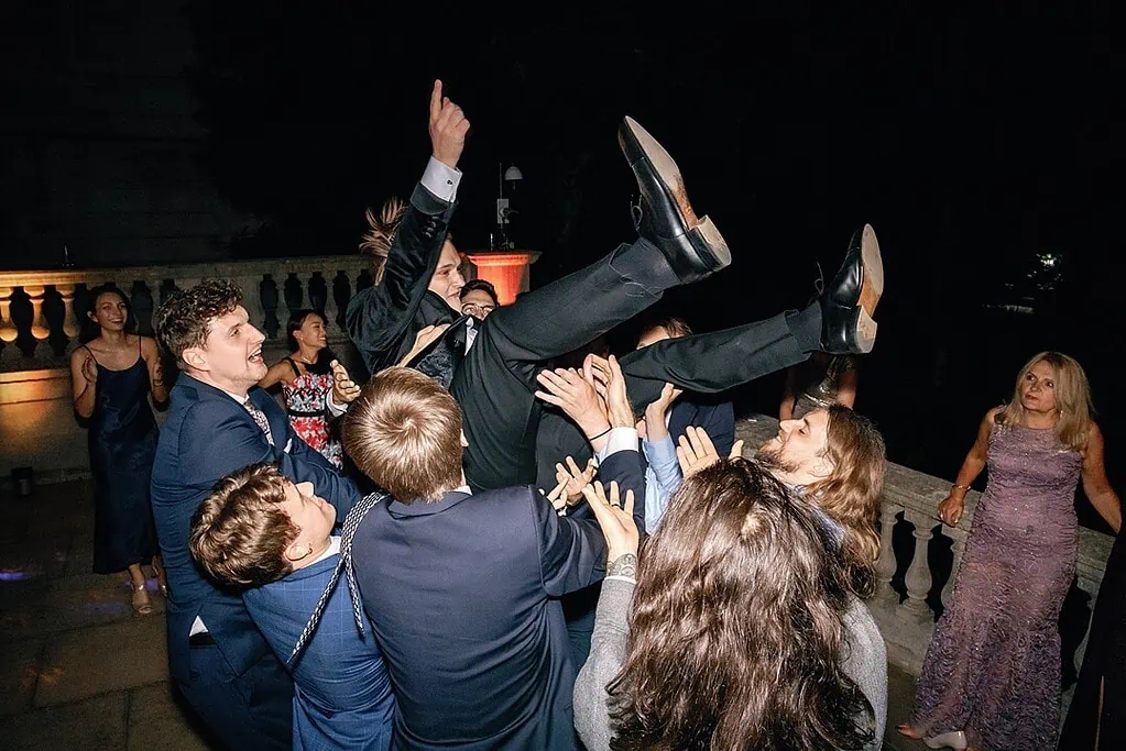 the groom crowdsurfing spencer house wedding photography