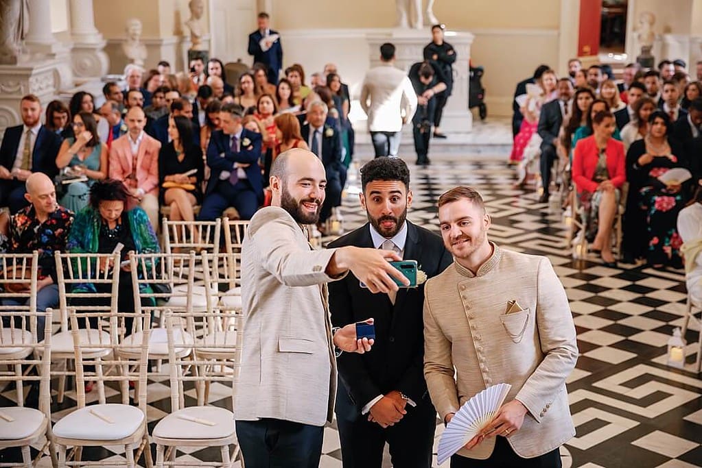 groom having a selfie with groomsmen at The Hilton Syon Park