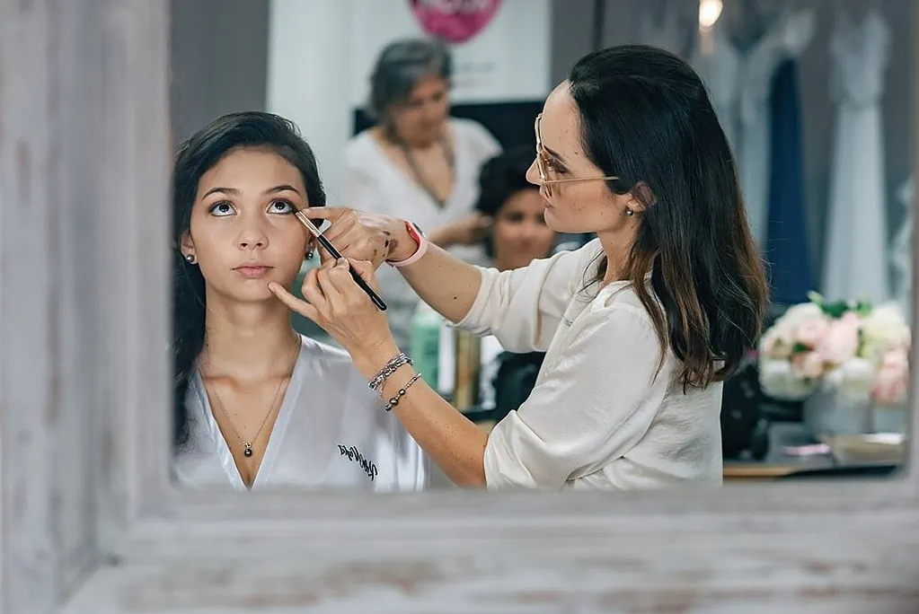 bridesmaid getting make-up in Tahiti