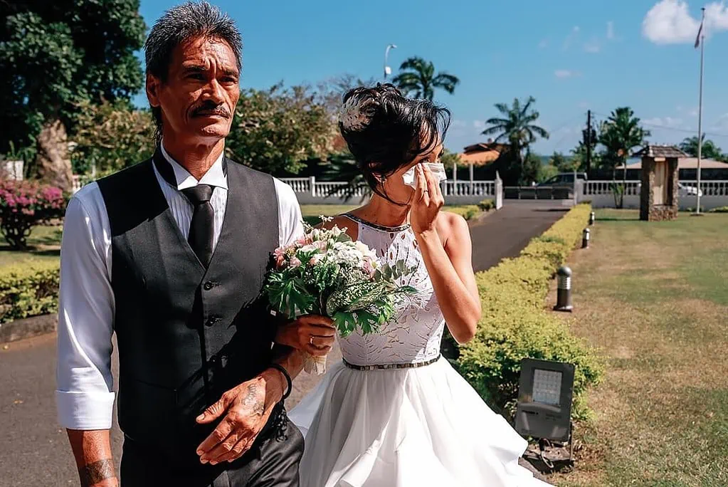 bride wiping away tears with her dad before the ceremony in Arue Tahiti