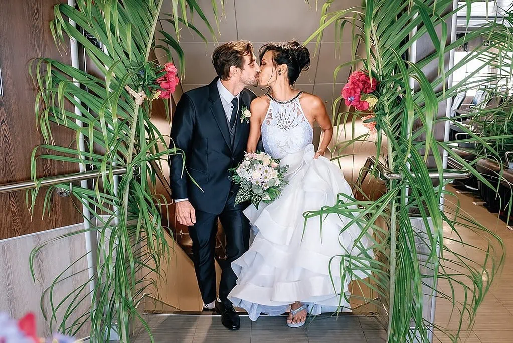 bride and groom kiss on the boat Tahiti Wedding Photographer