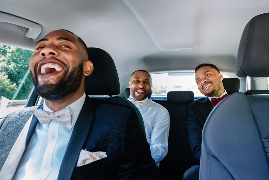 the groom and groomsmen driving to The Fennes