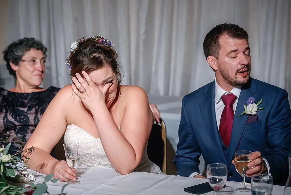 emotional bride during the wedding speeches