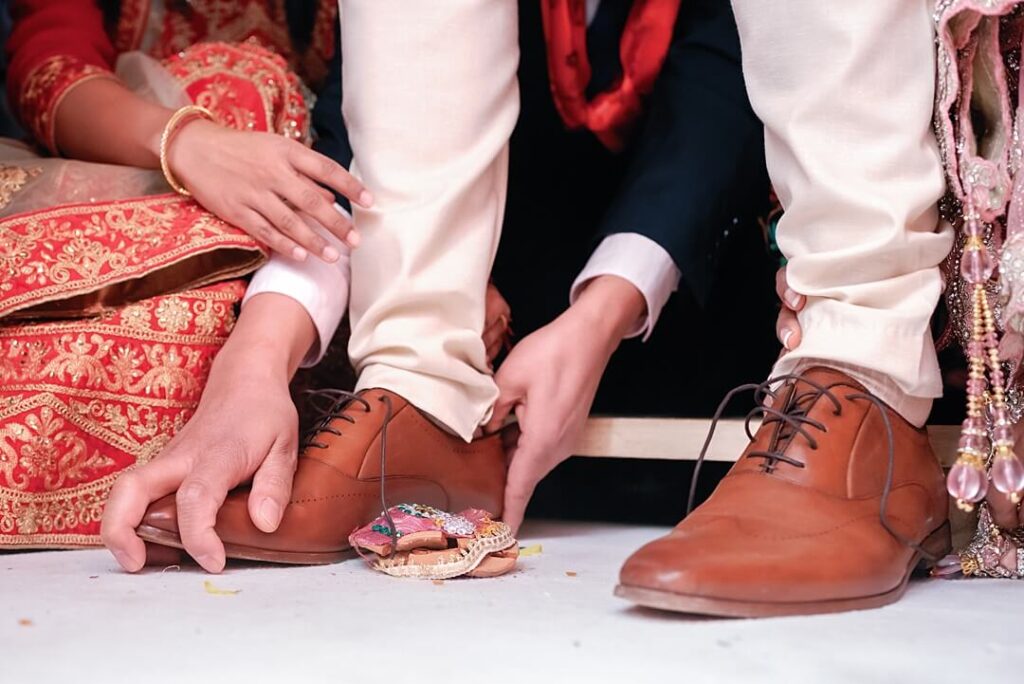 grabbing the shoes of the groom at Addington Palace