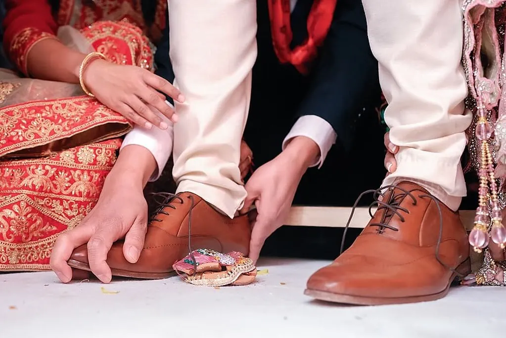 grabbing the shoes of the groom at Addington Palace