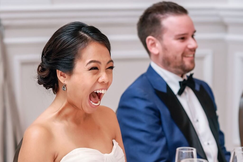bride's reaction to the speeches in The Ballroom at The Corinthia Hotel