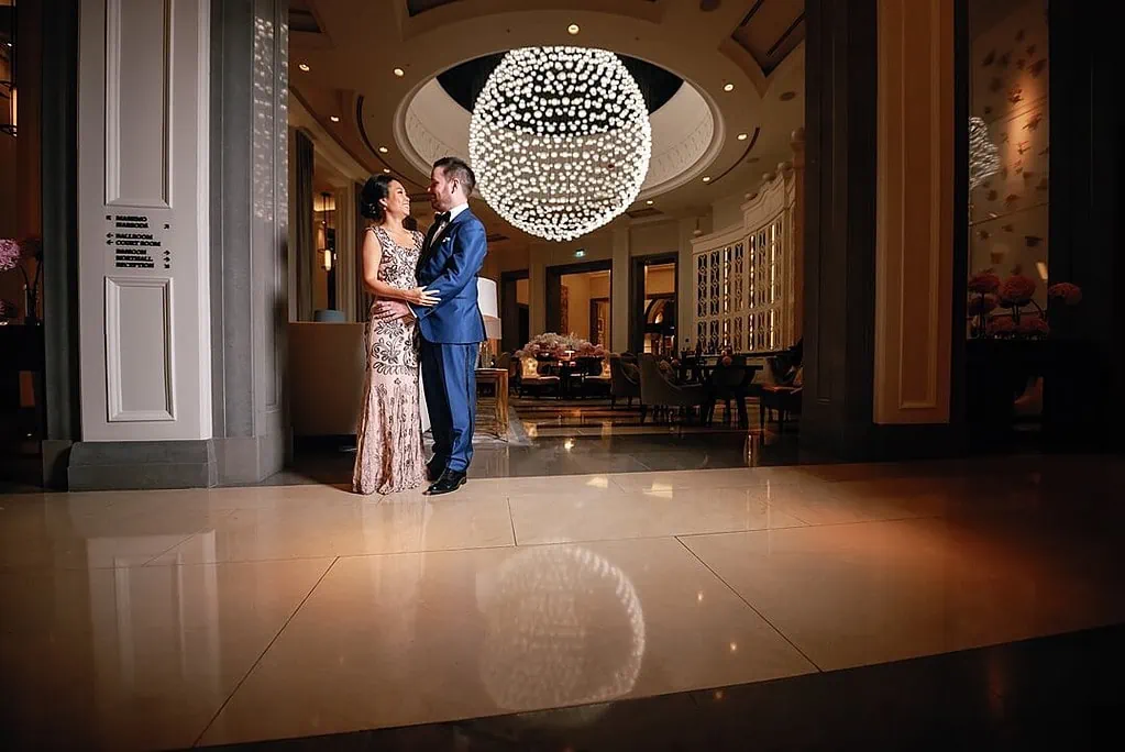 couple portrait in the lobby of The Corinthia Hotel