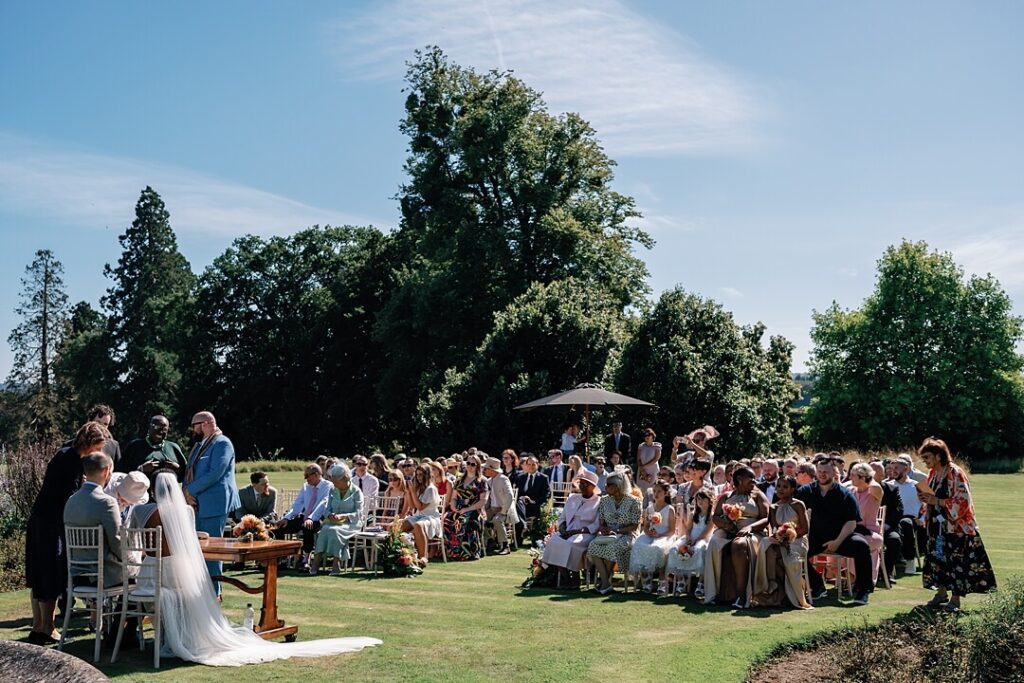 the outdoor wedding ceremony at cowdray house