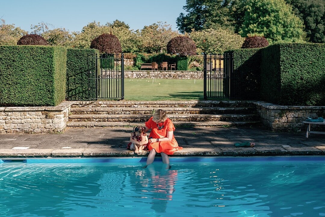 a mother and daughter by the pool at cowdray house