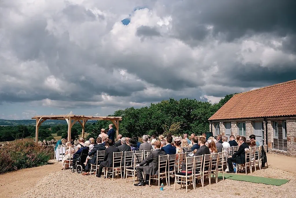 the wedding ceremony taking place outdoors