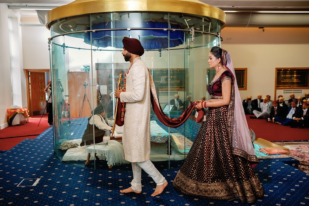 The Bride and Groom walking around the Holy Scripture - The Lavan Pheras