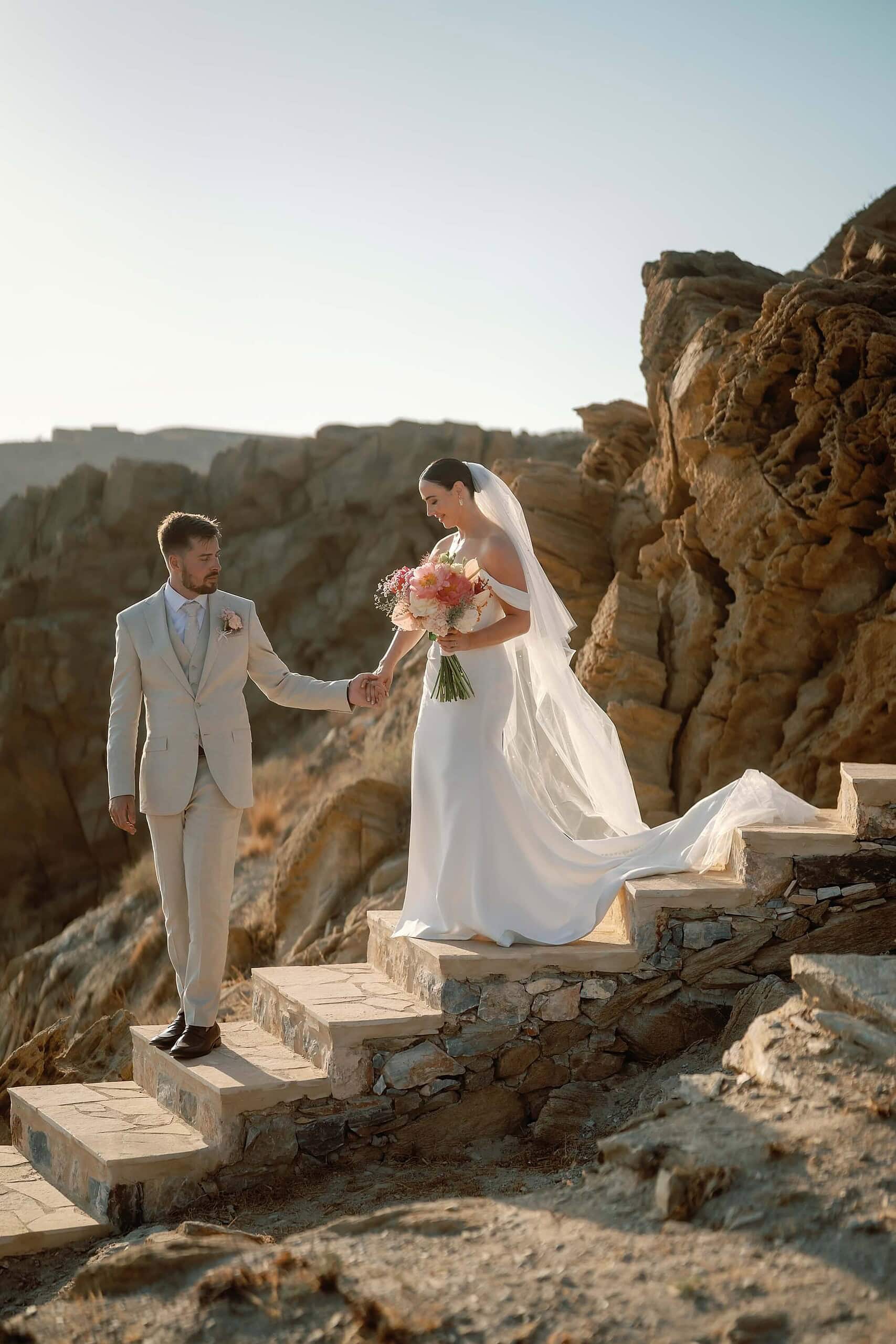 Bride and Groom walking down steps in Ios, Greece